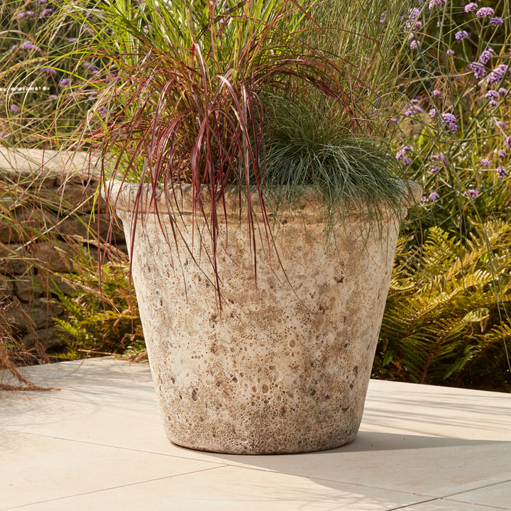 White Eris Ancient Glazed Stone Plant Pot with a traditional weathered finish, made from frostproof clay for year-round outdoor use.