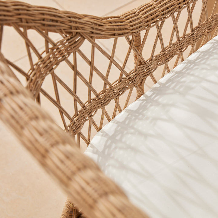 Detail of hand woven open weave design on garden armchair