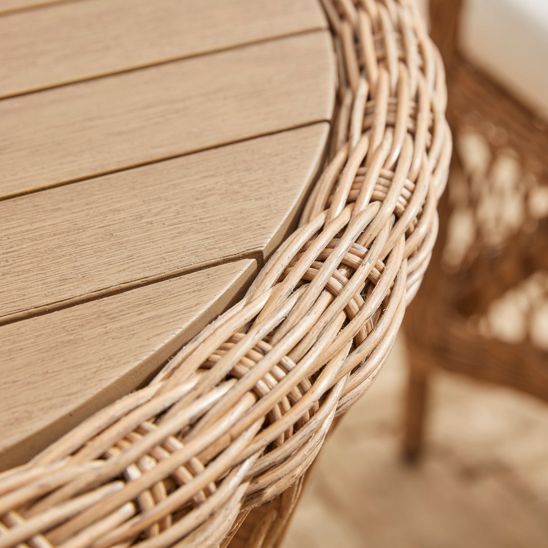 Solid acacia wood table set into an all-weather weave, hand woven frame