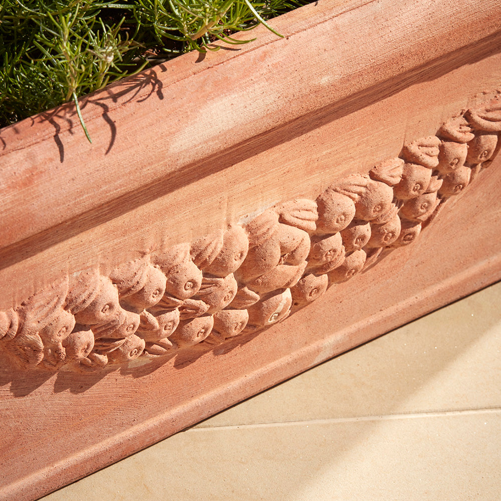 Close up of the Fiorella trough planter with hand pressed festoon garland, authentic to tuscan plant pot designs