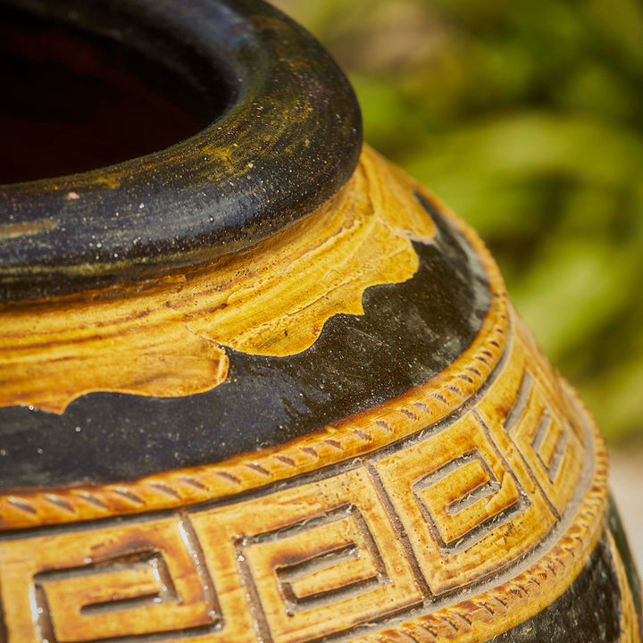 Close-up of ornate glaze detail on a handcrafted Chinese ceramic pot.