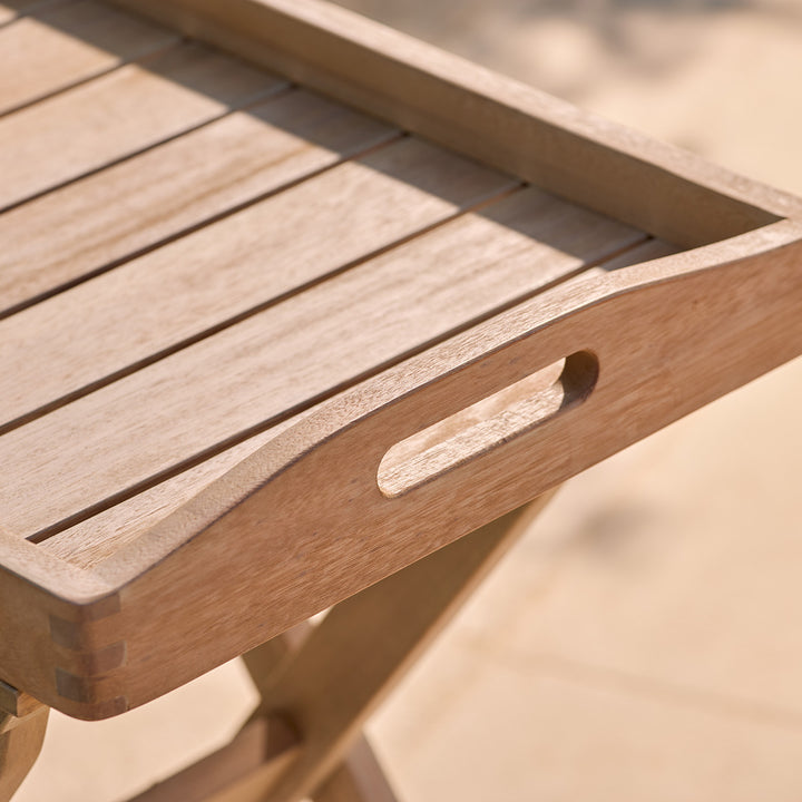 Close-up of a wooden butlers tray with a blurred background