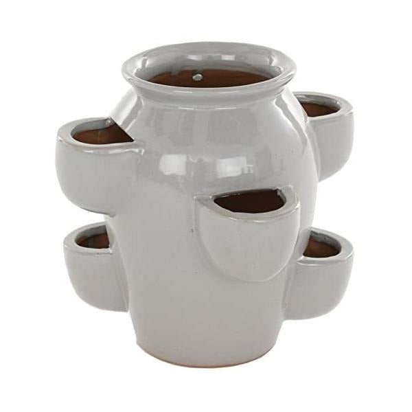 Another view of the ceramic planter, showcasing its symmetrical design and glossy light glaze.