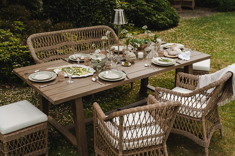table laid to savour summer salads in the garden 