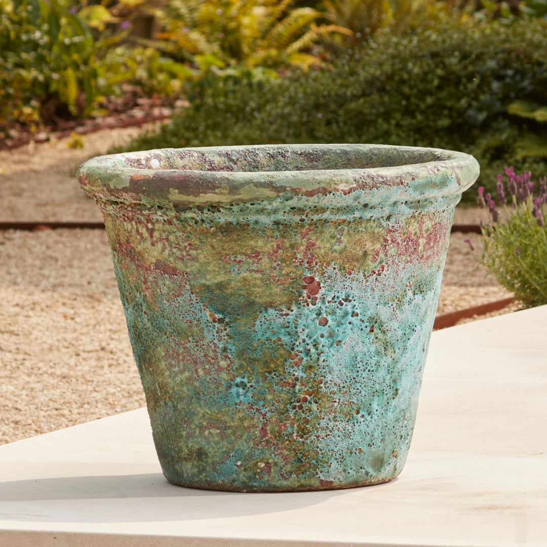 Turquoise Eris Ancient Glazed Stone Plant Pot with a rich salt glaze finish, adding a bold pop of colour and timeless charm to outdoor spaces.