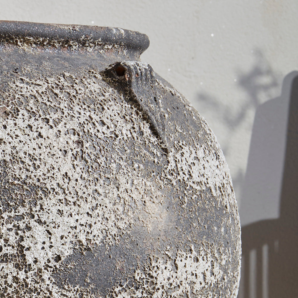 Detail image of Extra Large 86cm wide stone antique effect garden jar plant pot. Left unplanted and still making a statement in the garden. Large rounded shape is timeless