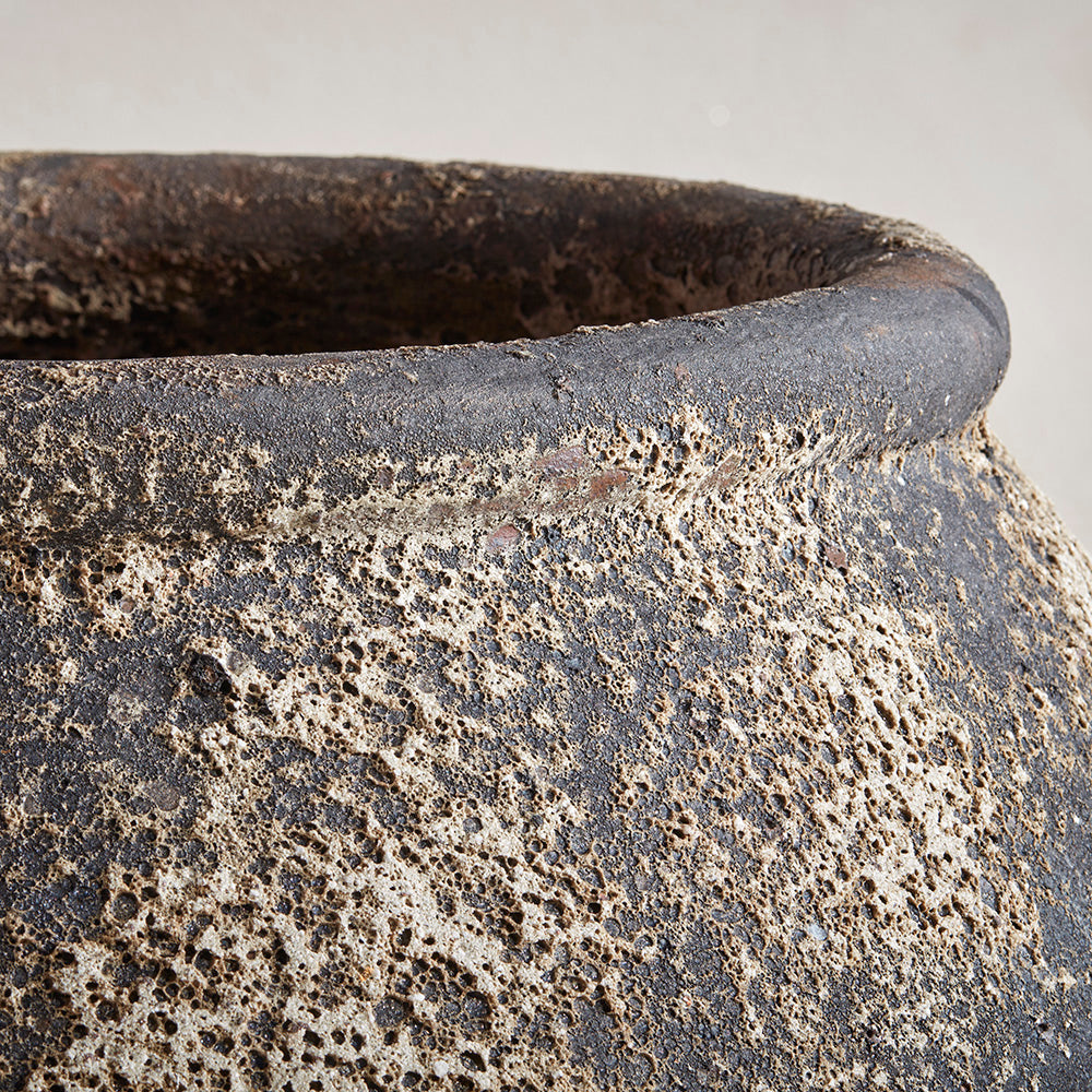 Detail image of ancient stone finish and durable, sturdy rim, with mineral formations adding depth and texture to the pot. Unique, one of a kind design for a tall garden planter uk