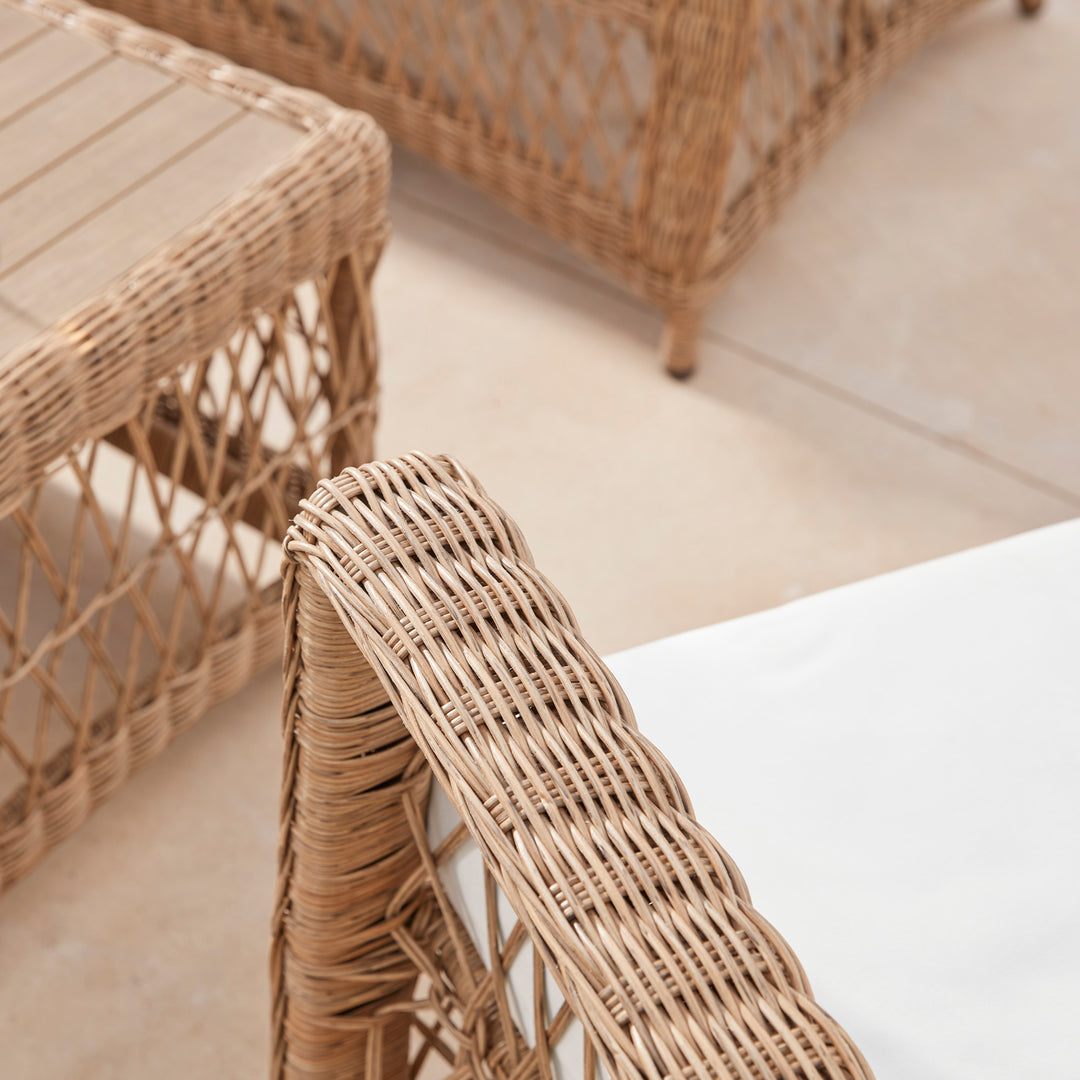 Close-up detail of hand woven garden chair arm on a cotswold patio 
