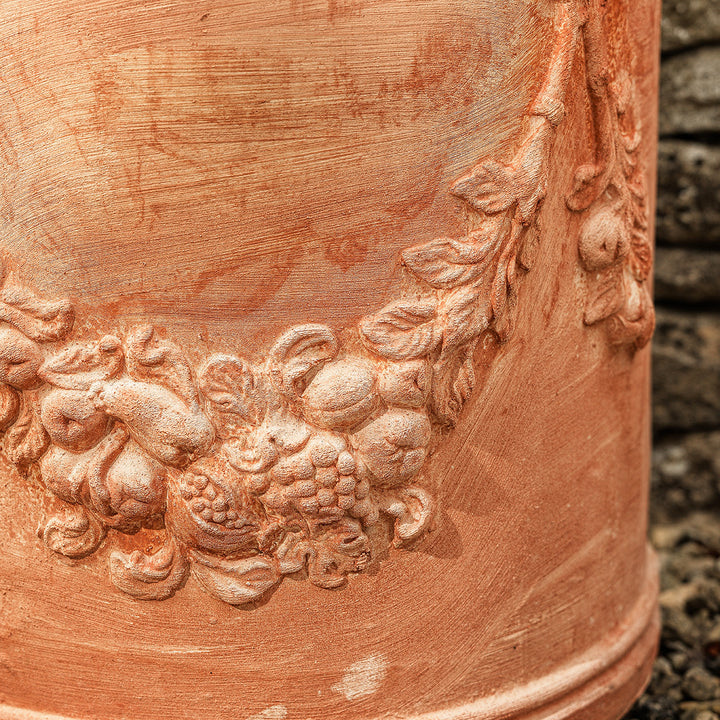 Delia Italian terracotta wall planter with garland design, perfect for classic gardens