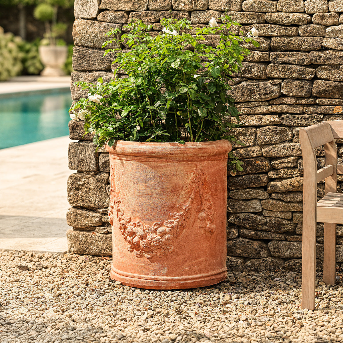 Delia Italian terracotta wall half planter with rustic clay finish for outdoor planting
