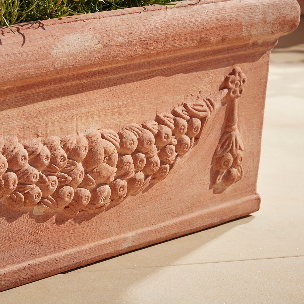 Close up of festoon garland and robust rolled rim of the Fiolla large trough planter 