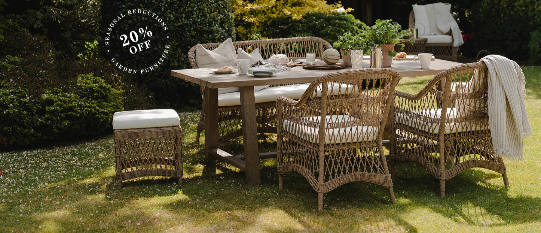 garden dining set with decorative weave design and solid wooden outdoor table, styled for a summer party alfresco