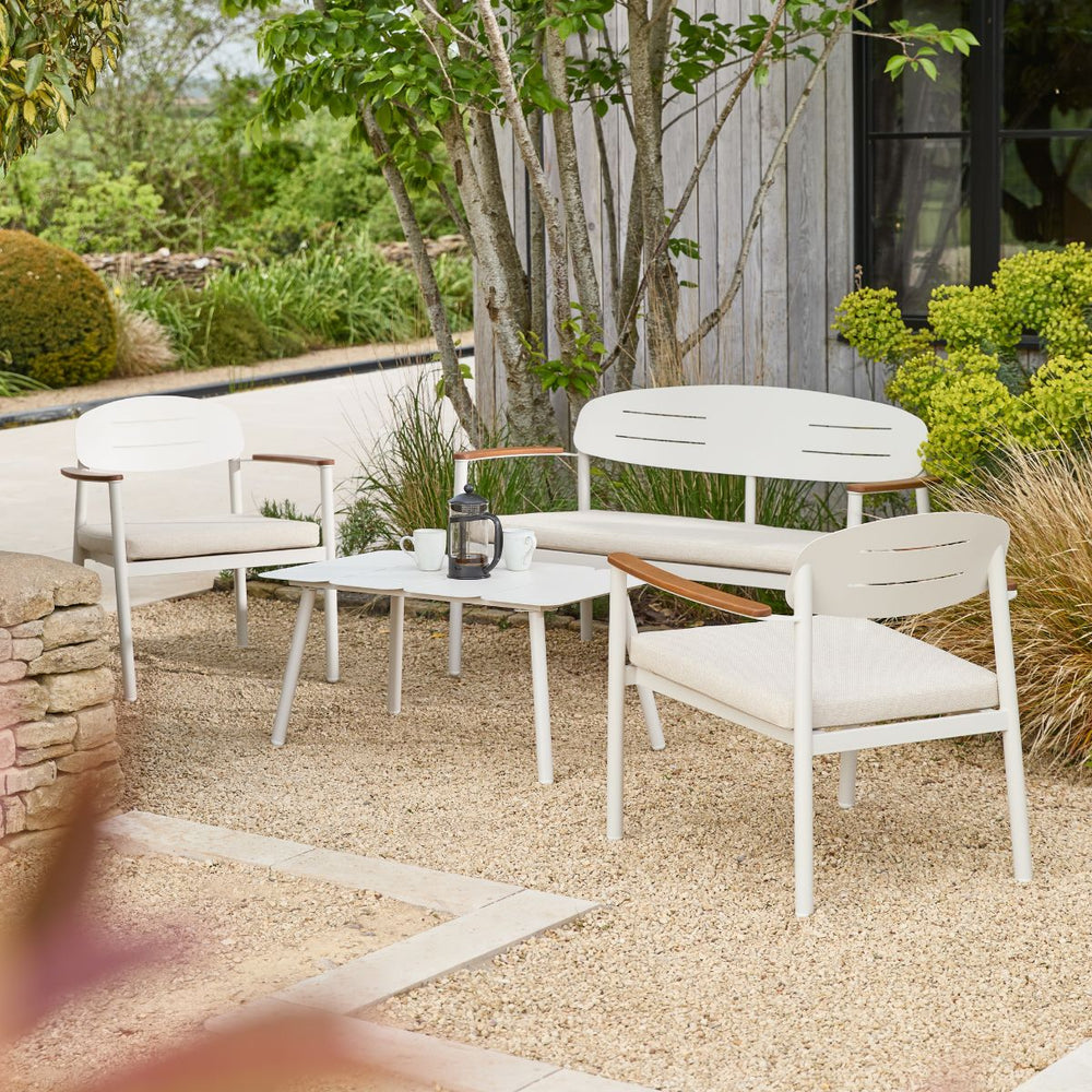 Modern powder-coated steel garden lounge set in light stone with outdoor cushions and eucalyptus wood armrests
