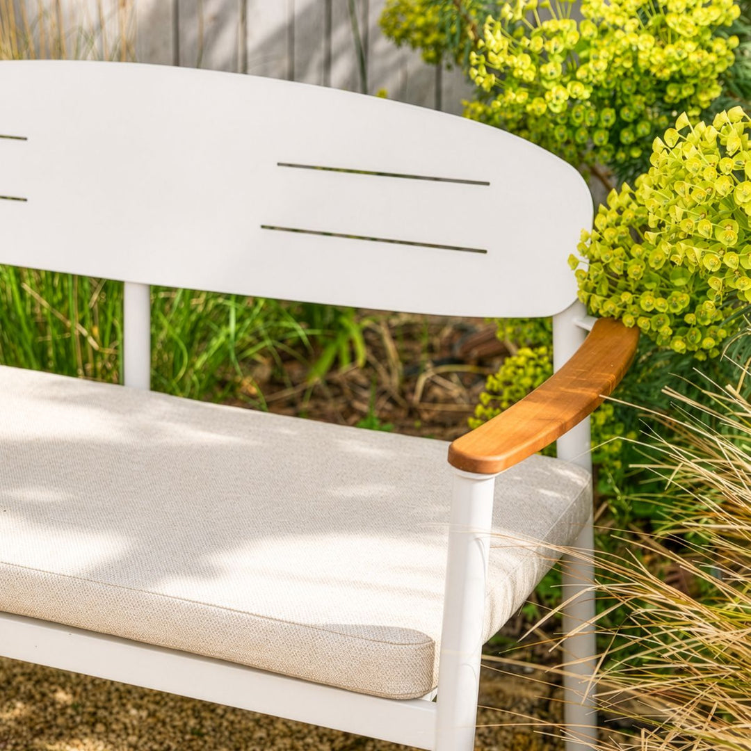 Contemporary metal garden seating with soft outdoor cushion and natural eucalyptus wood accents