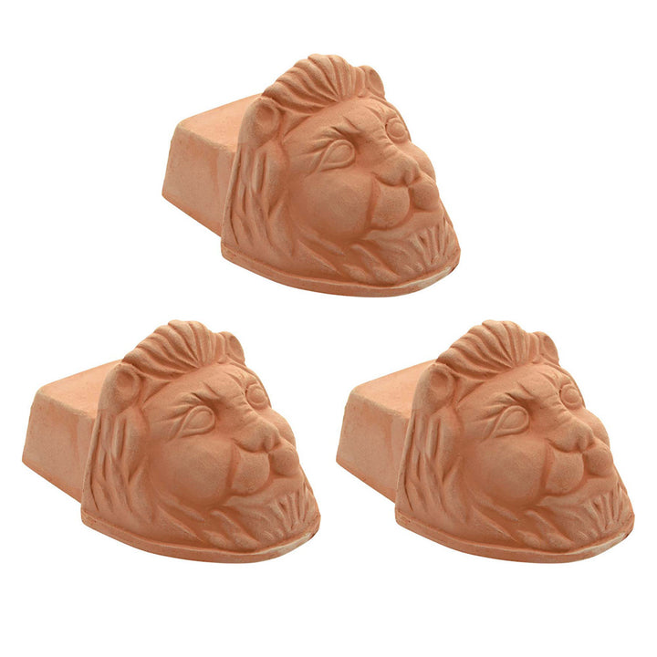 Set of 3 Italian terracotta lion's head pot feet on a white background 
