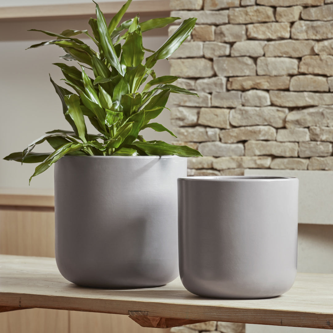 Nova Indoor Plant Pots in taupe and soft grey, featuring a contemporary design with a smooth, matte ceramic glaze.