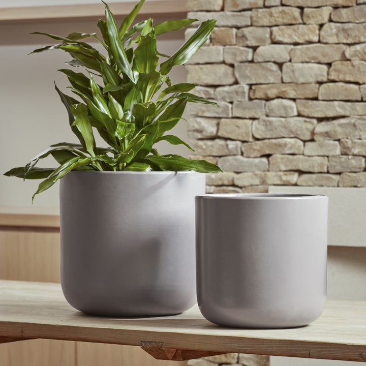 Nova Indoor Plant Pots in taupe and soft grey, featuring a contemporary design with a smooth, matte ceramic glaze.