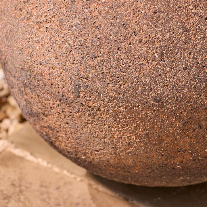 Close-up of a textured brown stone plant pots surface