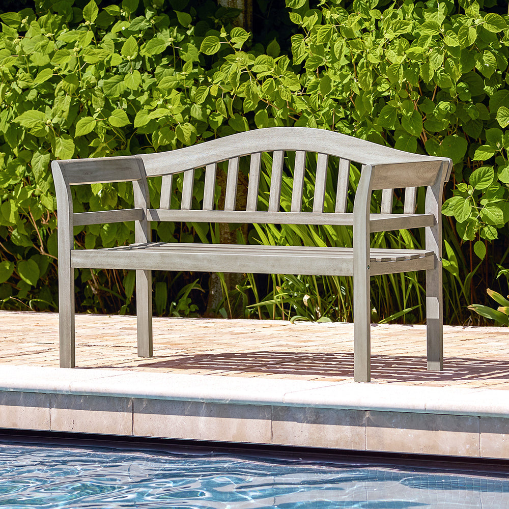 Outdoor 2 seater bench in grey wood finish placed beside a swimming pool, ideal for garden or patio seating.