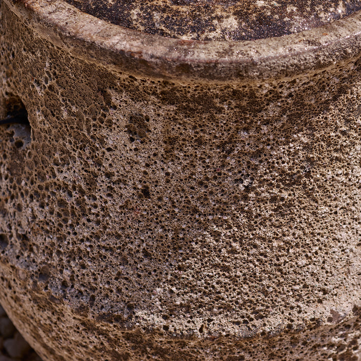 Close-up of a textured stone ceramic water feature