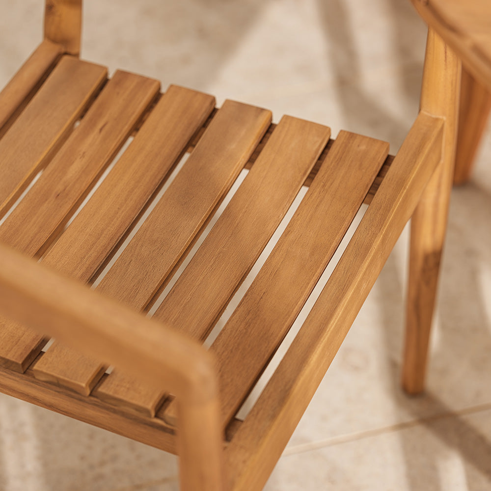 Close-up of a wooden chair with a blurred background