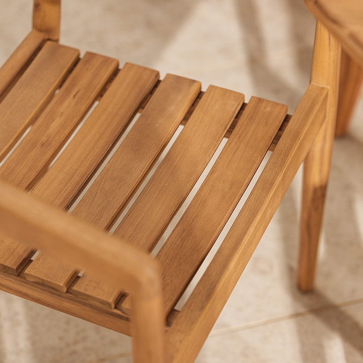 Close-up of a wooden chair with a blurred background