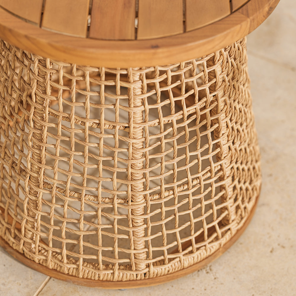 Close-up of a wicker side table with a textured surface.