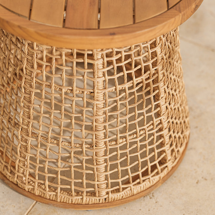 Close-up of a wicker side table with a textured surface.