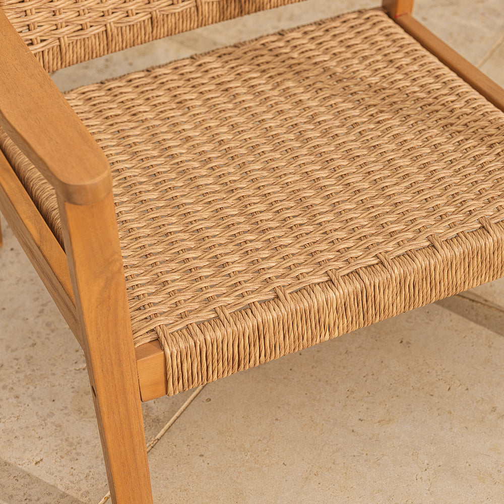 Close-up of a wicker chair seat on a tiled floor