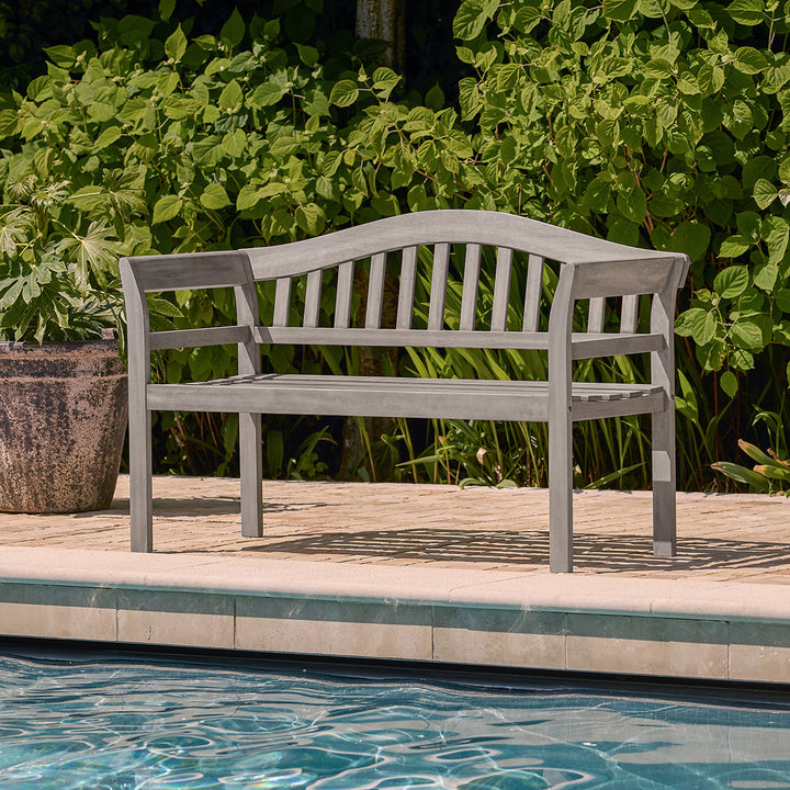 Outdoor 2 seater bench in grey wood finish placed beside a swimming pool, ideal for garden or patio seating.