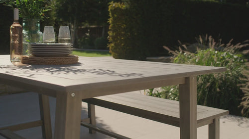 A collection of beautifully hand finished garden furniture and plant pots n a cotswold courtyard, creating a place to gather in the garden this easter 
