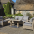 5 Seater Wood Effect Aluminium Garden Furniture Set with Height Adjustable Dining Table available at Gardenesque