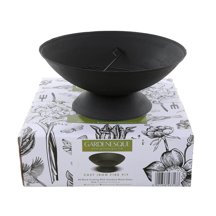 A black cast iron fire pit displayed on top of a decorative Gardenesque box, showcasing its shape and design.