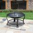 Metal Portable Round Fire Pit with Spark Guard Lid & Poker at Gardenesque